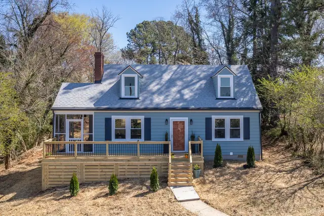 Front of the blue house with a screened porch and wood deck at 38 Norfolk Avenue, Lynchburg VA