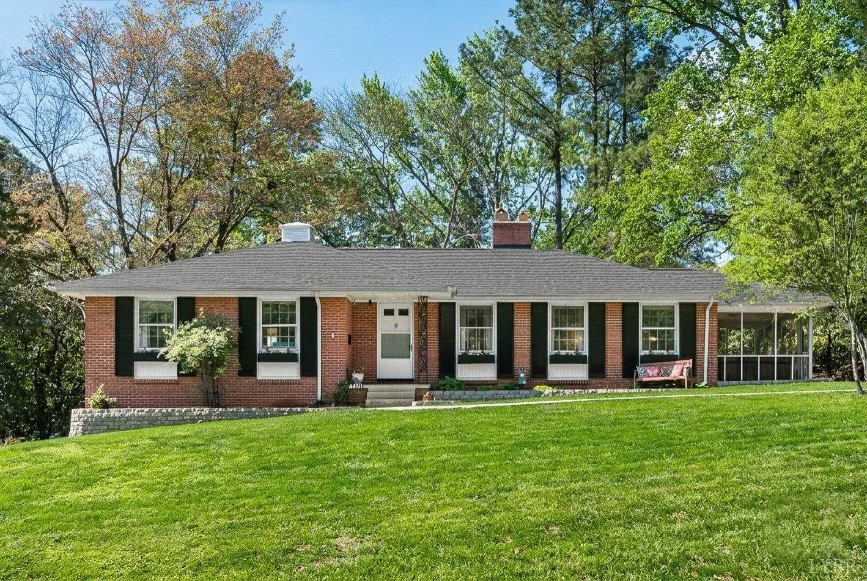 Front of the one-story brick house with black shutters at 4401 Montgomery Road, Lynchburg VA