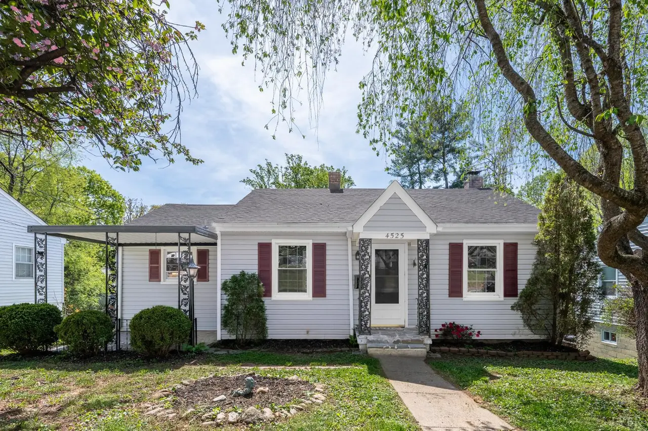 Front of the one-story house with red shutters and a carport at 4525 Brooklawn Circle, Lynchburg VA