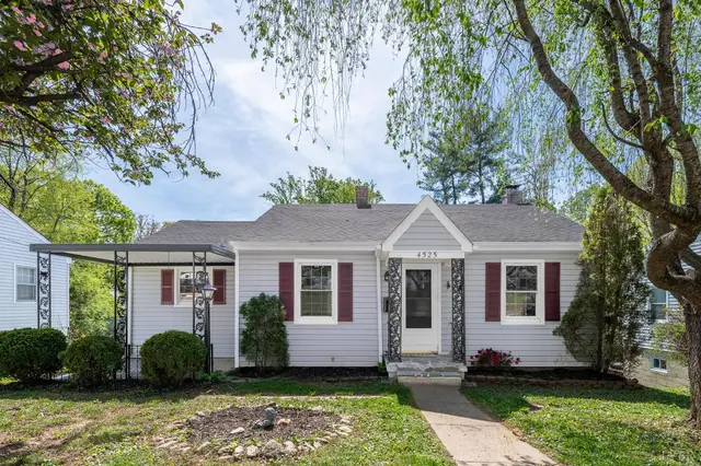 Front of the one-story house with red shutters and a carport at 4525 Brooklawn Circle, Lynchburg VA