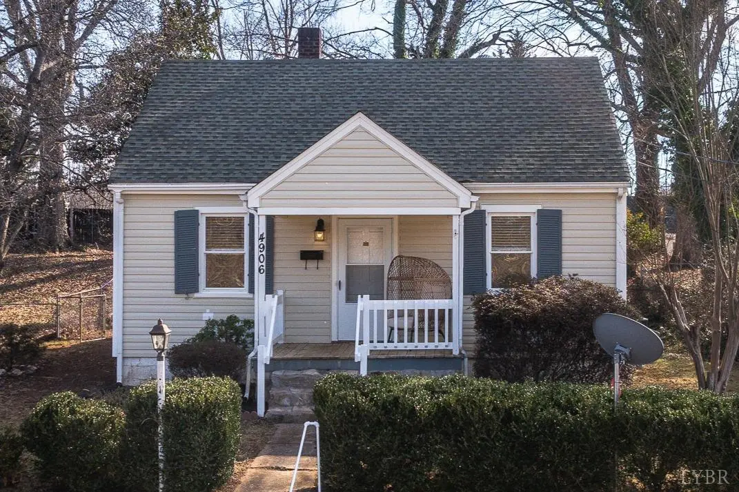 Front of the house with gray siding and a small covered porch at 4906 Sycamore Pl, Lynchburg VA