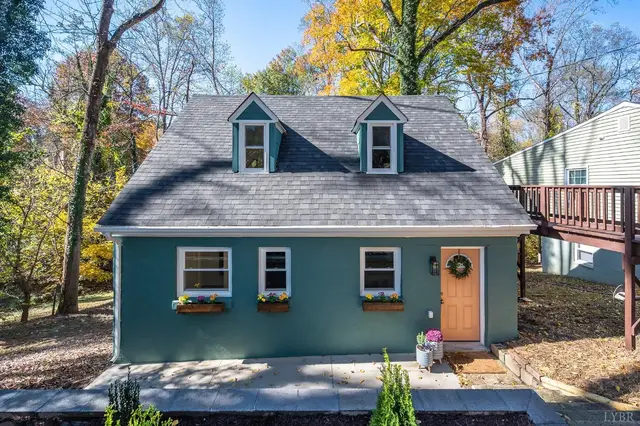 Front of the teal house with two dormers and an orange door at 50 W Princeton Circle, Lynchburg VA