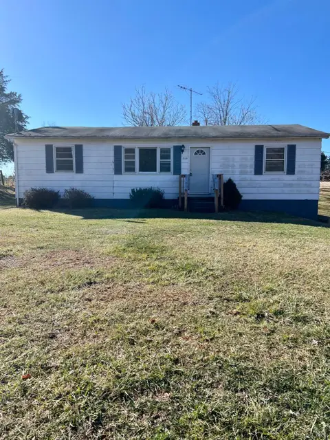 Front of the one-story house with white siding and blue shutters at 519 W E Monitor Road, Amherst VA