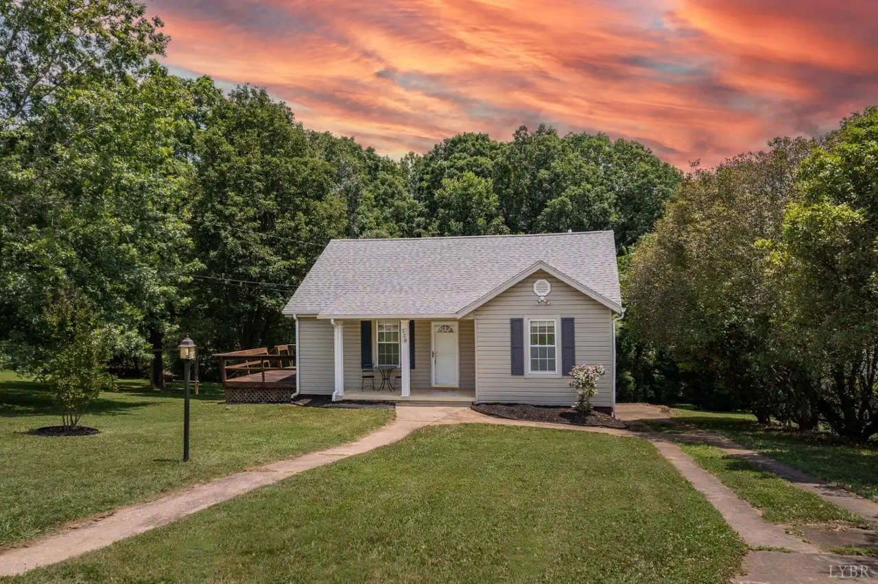 Front of the house with gray siding and a curved walkway at 528 Highwayview Road, Hurt VA