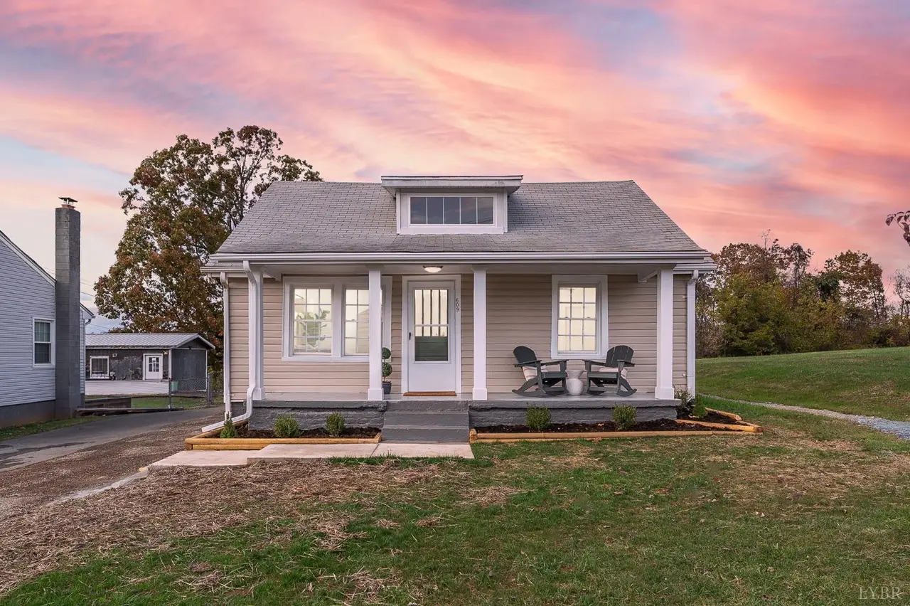 Front of the house with a covered porch at sunset at 609 Pine Drive, Lynchburg VA