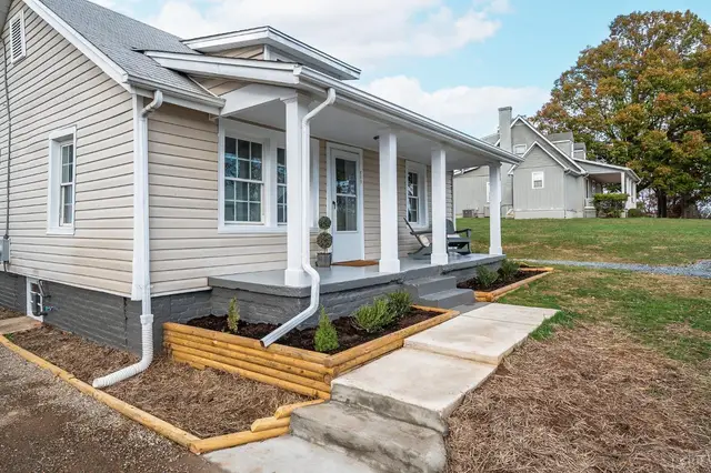 Covered front porch with white columns and new landscaping beds at 609 Pine Drive, Lynchburg VA