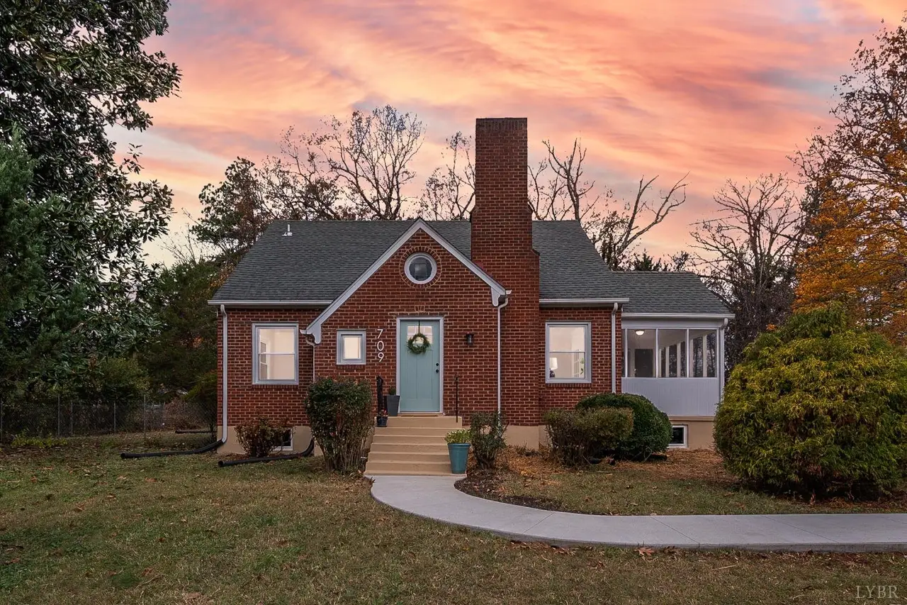 Front of the brick house with a chimney at sunset at 709 Old Graves Mill Road, Lynchburg VA