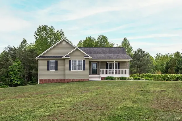 Front of the house with tan siding and a covered front porch at 7179 Stage Road, Concord VA