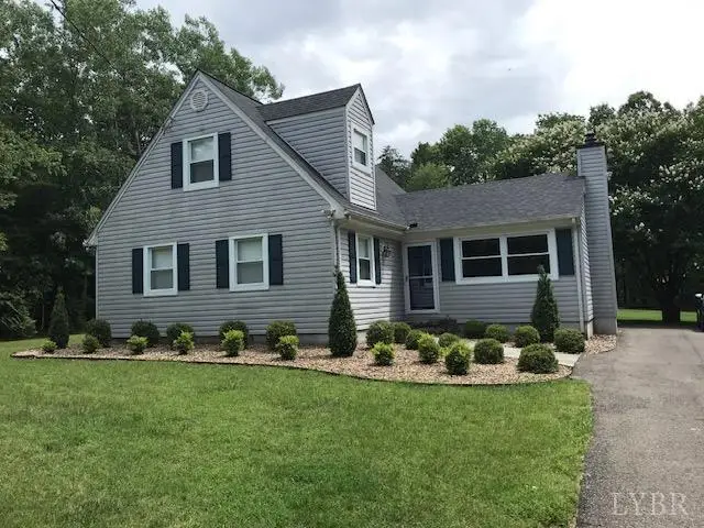 Front of the gray house with dormers and a paved driveway at 97 Settlers Row, Lynchburg VA