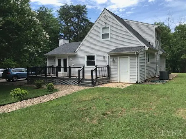 Back of the gray house with a deck and black railings at 97 Settlers Row, Lynchburg VA
