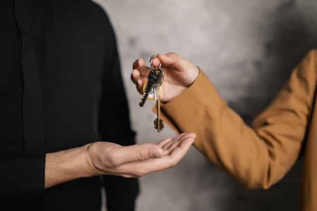 Handing over keys to new rental property